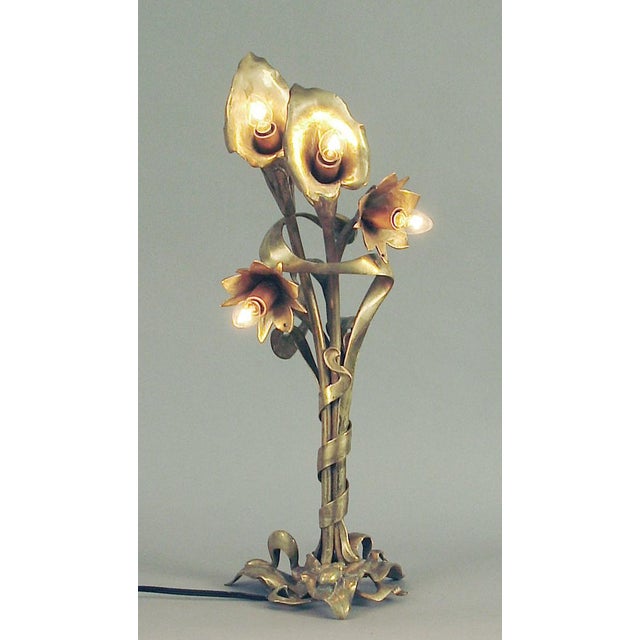 Offering an exceptional, handcrafted Art Nouveau table lamp. Fashioned in solid brass, with its warm antique patina...