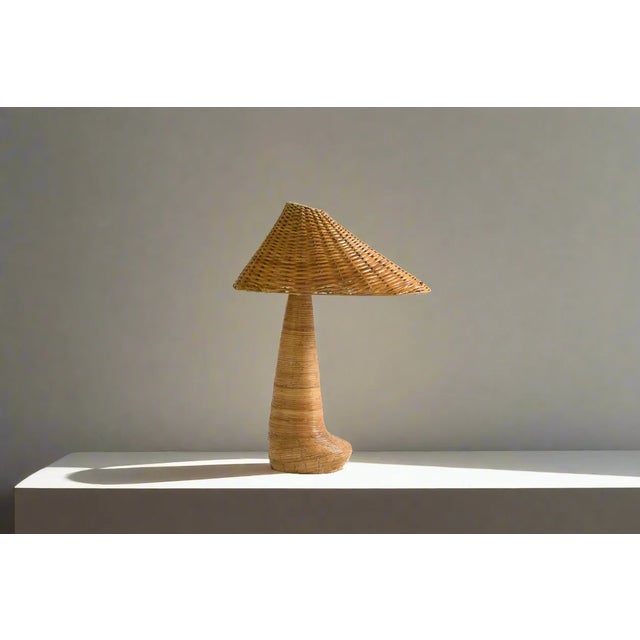 Introducing the Chloe Rattan Table Lamp - a unique and exquisite piece handcrafted to the highest quality. Its unusual...