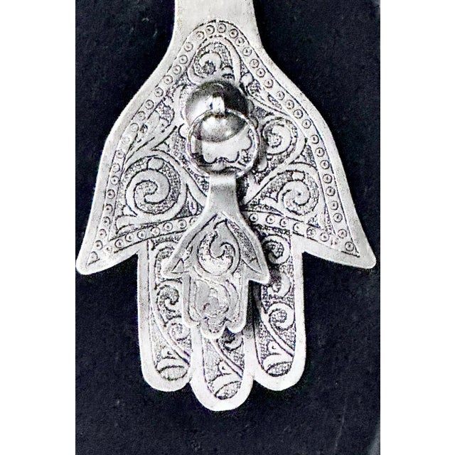 Hamsa, the Hand of Fatima Size: 4.25” w x 6.25” h x 0.75” d Framed size: 8” w x 11” H x 0.75” d Description: Hamsa,...