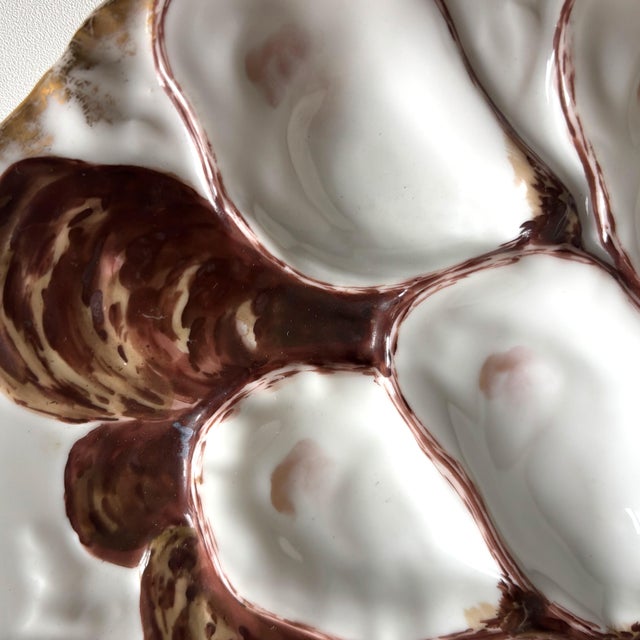 Bring French elegance to your table with this stunning antique oyster plate, crafted by Haviland & Co. Limoges in the late...