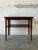 This rectangular coffee table features clean lines and a functional two-tier profile. The inset surface showcases a...
