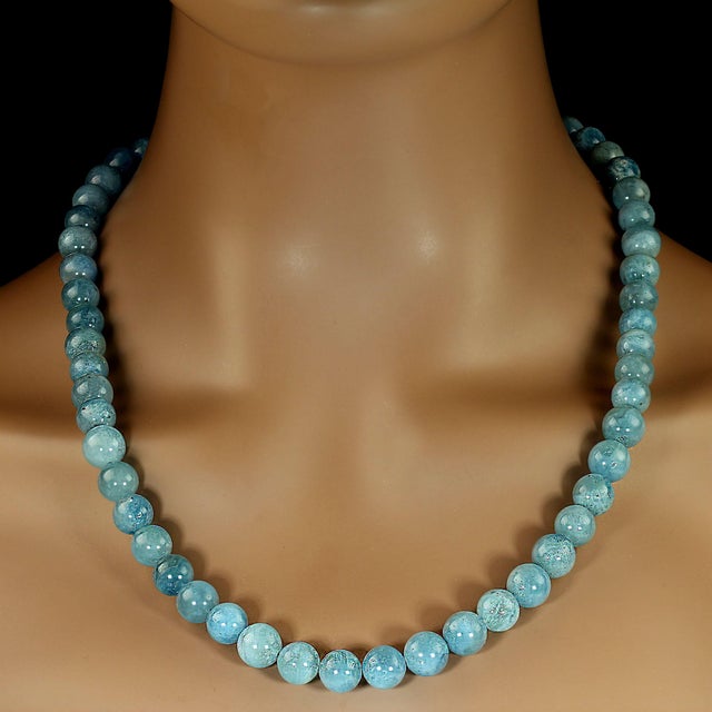 This necklace features beautifully translucent aquamarine gemstones, each one polished to a radiant, glass‑smooth finish...