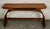 This is a stunning mid-century teak console table. The table top is supported by beautiful bent wood legs that form an...