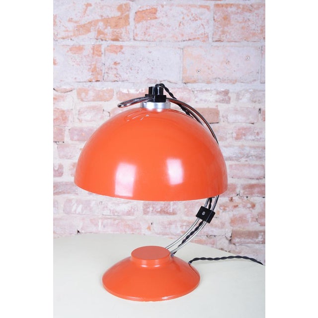 This table lamp is a bold representative of Czechoslovak design from the 1970s, a period known as Mid-Century. The lamp...