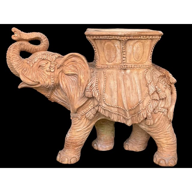 This is an Italian Hollywood Regency style cast terracotta elephant for garden seat. He has some very nice detail and is...