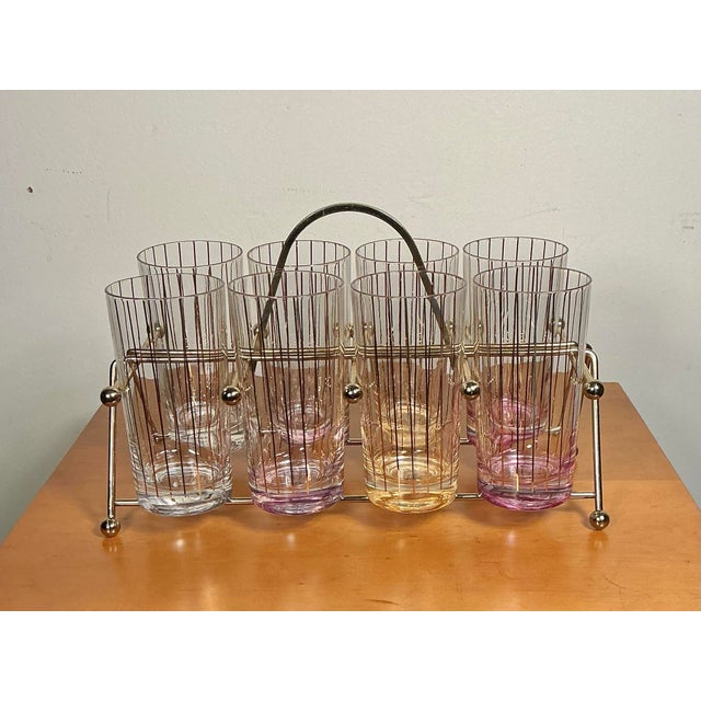 Charming 1950s and 1960s atomic/mid-century modern, Culver Gold Vertical Striping Highball Glasses with brass atomic...