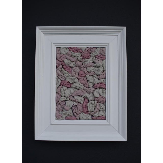 This wall-mounted relief sculpture by María Magán consists of dozens of compressed forms arranged in a dense, tactile...