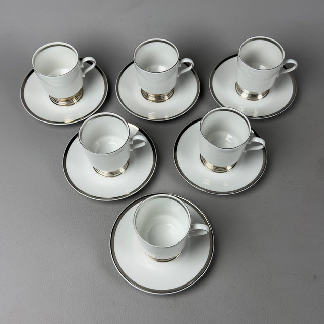 A refined complete service for 6, combining the quality of German porcelain with the finesse of silverware. The set...