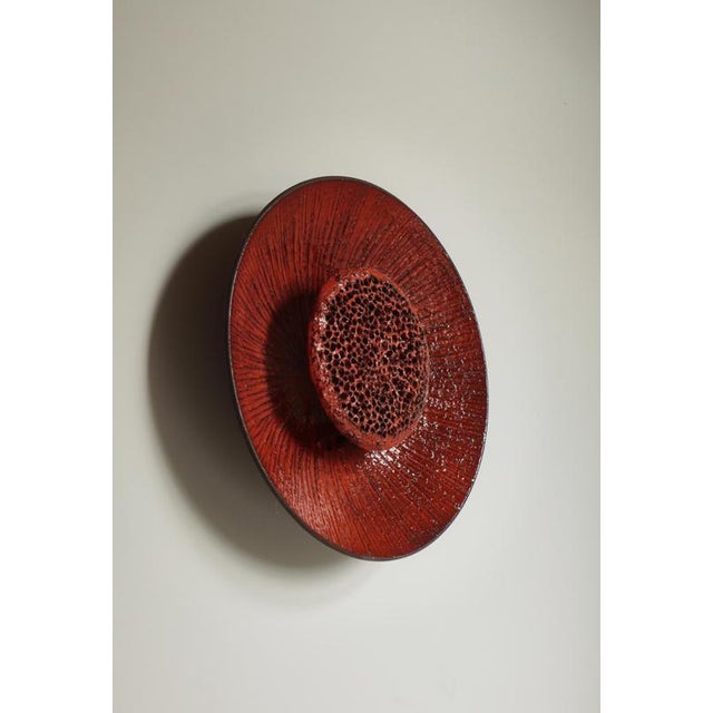 Huge ceramic wall sconce in glossy red glazing from Danish manufacturer "Sejer" hand made in the 1960s. Shaped as a sun...