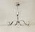 Nickel-plated Art Deco chandelier, made in the 1920s/30s. Three curved arms with crystal glass shades. Closed at the...