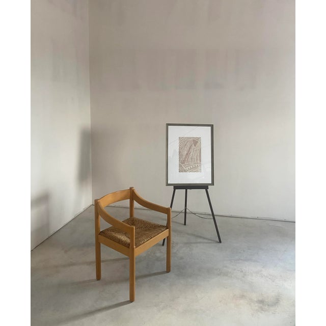 Framed contemporary textile artwork in a soft palette of blush and ivory. The composition features fluid, abstract forms...