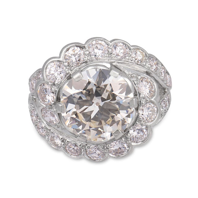 This striking Mid Century engagement ring showcases a bold 2.26 carat old European cut diamond, radiating soft, romantic...