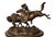 Capture the spirit of the Old West with this striking bronze reproduction of Frederic Remington’s iconic sculpture,...