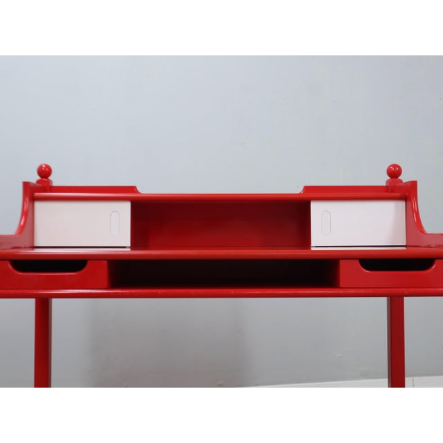 This striking red lacquered solid wood chair is a true expression of Italian 1960s design, where rustic charm meets...