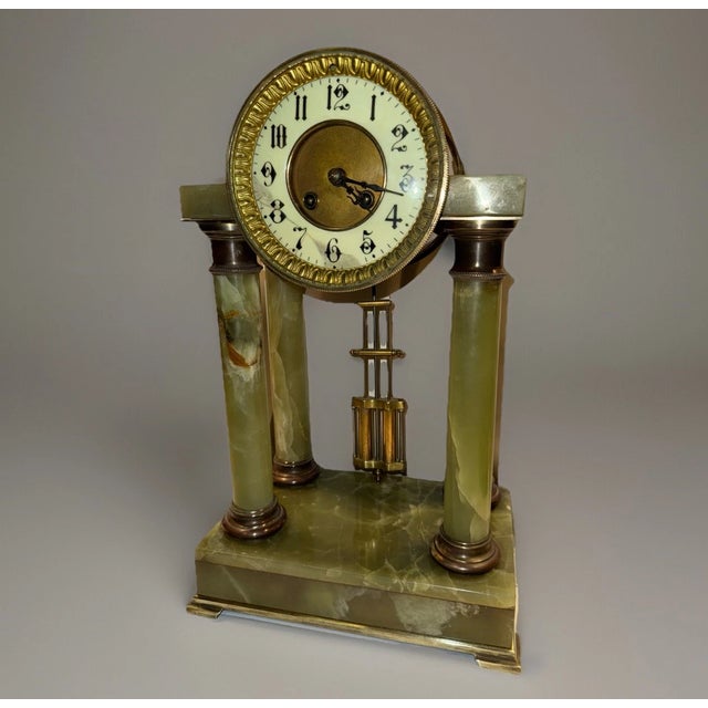 This listing is for a nice antique French mantel clock. The clock has an elegant portico style design with exposed...