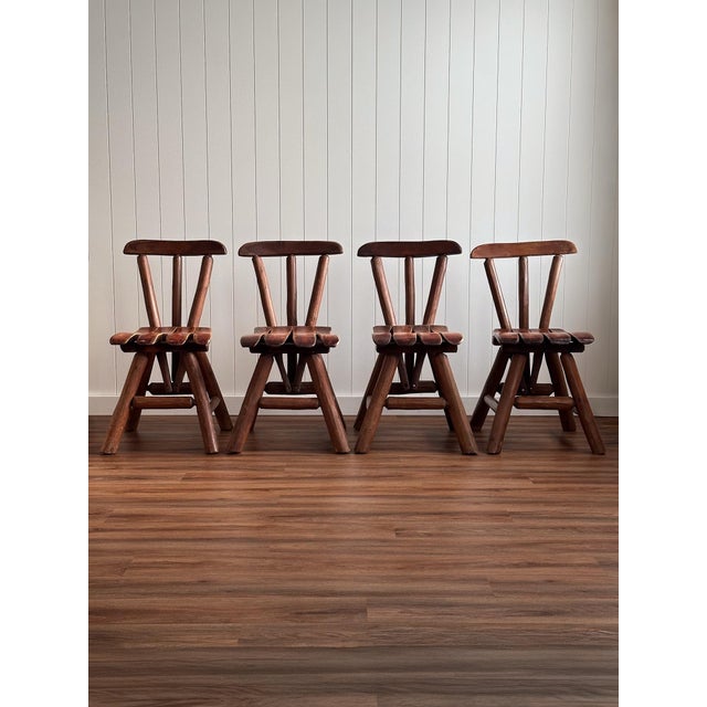 Handcrafted from solid wood, these artisanal dining chairs have a grounded, sculptural presence with an easy, natural...