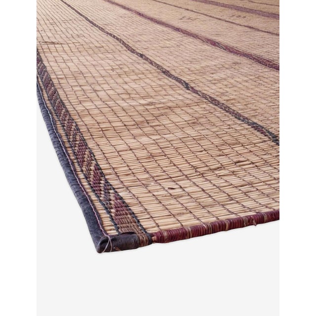 Mauritanian Tuareg Mat Rug: A Nomadic Masterpiece for Modern Interiors The Mauritanian Tuareg Mat Rug (14.11 × 7.4 ft) is...
