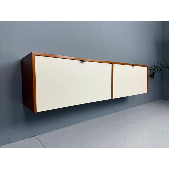 Elegant wall-mounted storage cabinet designed by Florence Knoll for Knoll Associates, model 122 W-1, produced in the late...