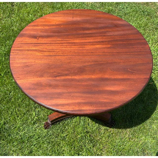 This is a stunning, late 19th century, mahogany, pedestal table. Its simple design is complimented by the delicate carving...