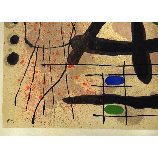 Le Lézard aux Plumes d'Or is a beautiful colored lithograph on mother-of-pearl Japan paper from the series realized by...