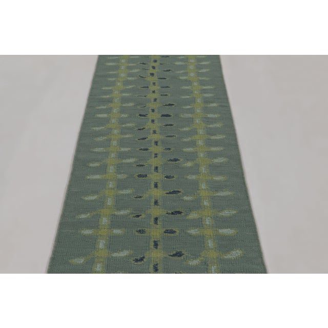 Handwoven in wool and undyed natural yarns, this 3x8 flatweave runner is a premier selection from our contemporary...