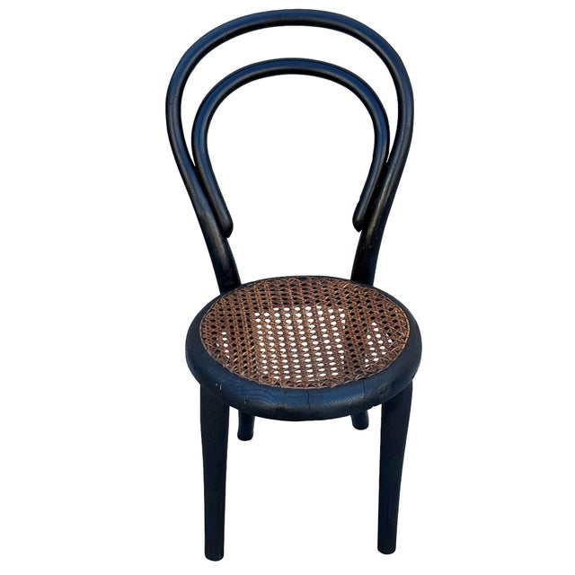 Victorian child size Thonet number 13 side chair features an elegant, sculptural frame crafted from warm-toned bentwood...
