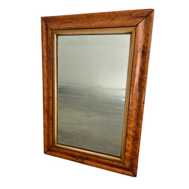 Vintage burl wood wall mirror showcasing the rich swirling grain and warm honey tones that make burl veneers so highly...