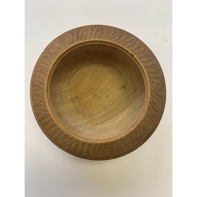 A nice catch all for change or jewelry, this wood carved bowl shows the beauty of wood with fine craftsmanship.