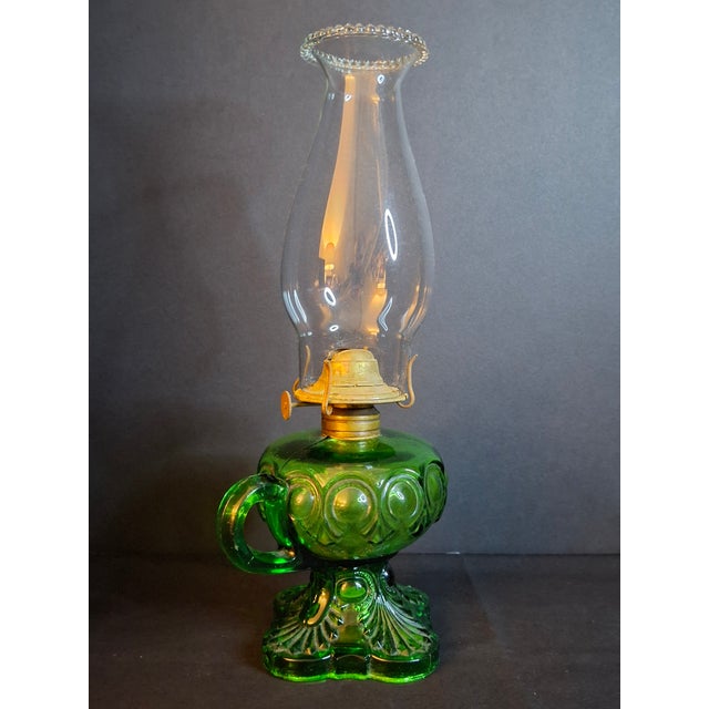 Up for consideration is a striking mid-century vintage L.E. Smith Glass Company "Moon and Star" finger oil lamp in vibrant...