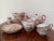 Japanese set of china in red, Kutani style, also called “geishaware”. Eggshell porcelain finely decorated with landscapes...