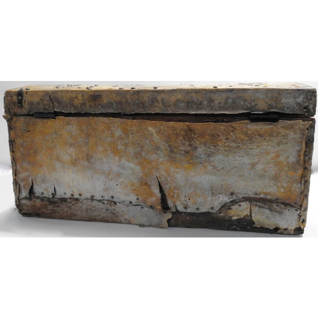 We are featuring a rustic trunk which is made of wood and covered in animal hide and finished with metal brackets and...