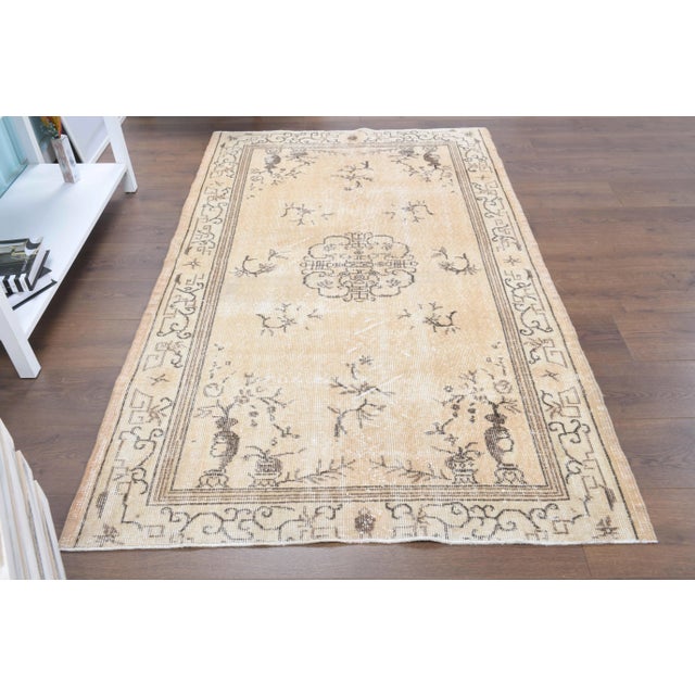 Vintage Turkish Hand-Knotted vintage rug is a semi-antique vintage area rug.'70s Eastern region of Turkey's unique rug is...