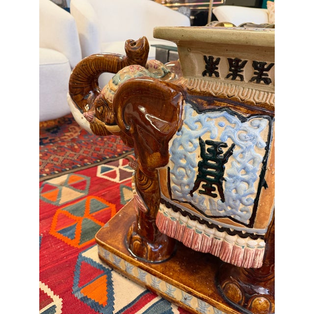 Vintage heavy pottery ceramic elephant garden stool. It makes a fantastic side table as well. The warm detail and...