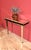 Art Deco style mirrored console table, a hall stand designed with beveled mirror panels covering both the surface and...