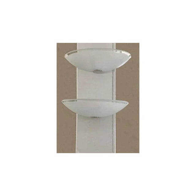 Mid-Century Pair of Lightolier sconces made of frosted glass is a clear glass edge and chrome hardware to hold it.