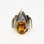 14k Ring by Limoge with approximate 2.50 carat cabochon yellow sapphire and approximately 0.25 carats of round diamonds....