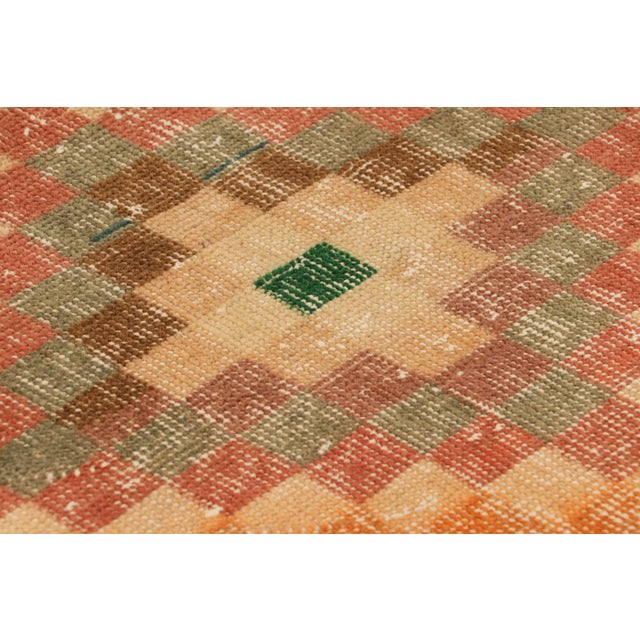 Hand-knotted in wool and originating from Turkey circa 1960 – 1970, this 2x3 vintage Zeki Müren rug is a unique addition...