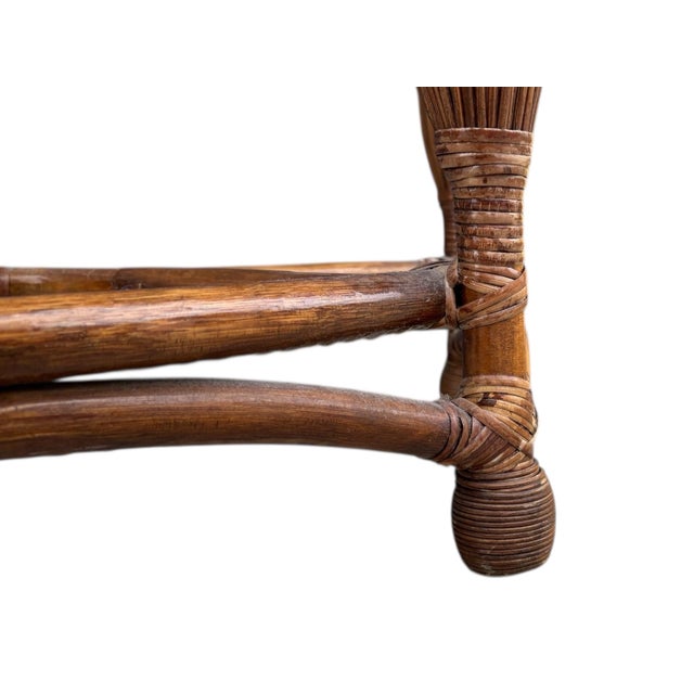 1970's demilune hall table. A bamboo frame is secured on the joins with rattan wrapping. The demilune table top is covered...