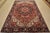 An authentic vintage traditional tribal Heriz rug hand-knotted with fine wool and natural dyes. This rug features a...