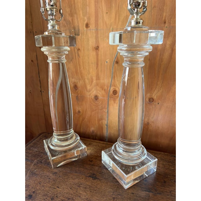 An elegant pair of architectural column table lamps produced by Restoration Hardware circa 2006, exemplifying the brand's...