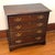 Late 20th century mahogany bachelor chest in the Chippendale style. A pull out brushing slide sits under the molded top....