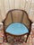 Louis XVI style caned office chair, 20th century, in mahogany-brown stained wood. The backrest is basket-shaped (barrel-...