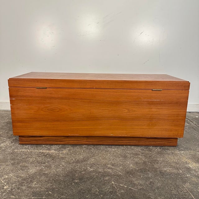 Mid century modern Riis Antonsen Danish Teak Chest Trunk. This trunk features a teak wood finish that opens on the top....