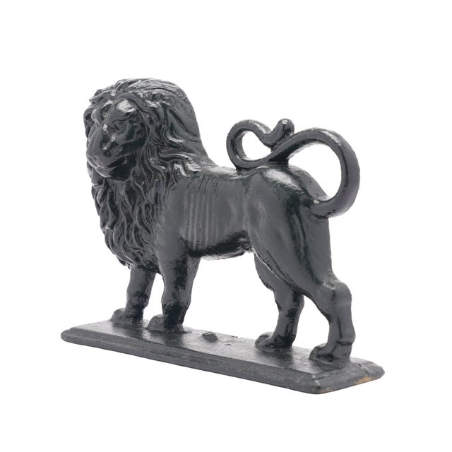An English Victorian doorstop cast in iron as a standing lion, dating to the second half of the 19th century. The mane is...