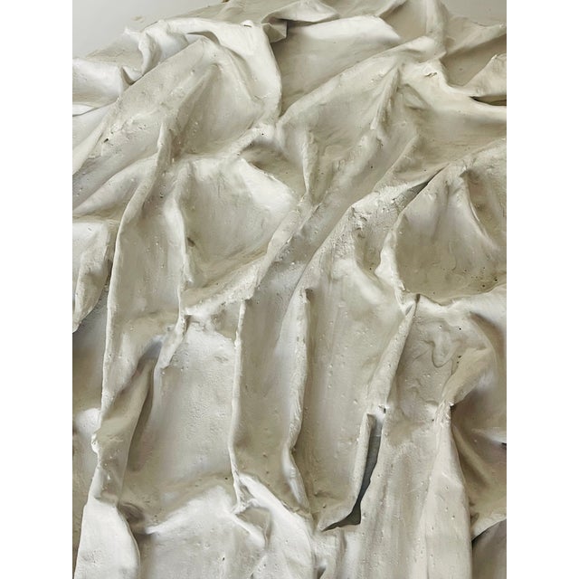 Abstract minimalist plaster artwork by Elia. Moon ridges.Textile, plaster on round wood board.