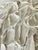 Abstract minimalist plaster artwork by Elia. Moon ridges.Textile, plaster on round wood board.