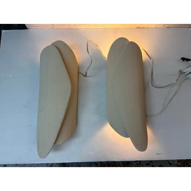 Design Plus Gallery presents a Pair of Ivory Palm Sconces by Olivia Cognet. These hand built ivory stoneware wall sconces...