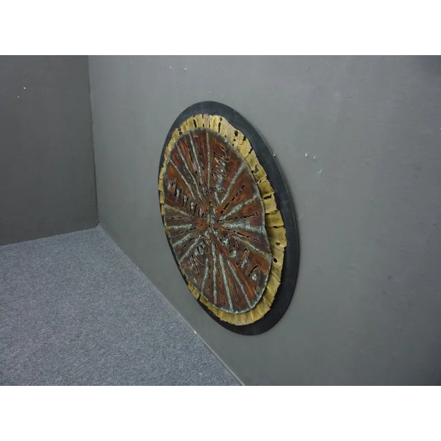 Large Brutalist wall object. Material: The round black base plate is made of metal. The two plates above are made of...