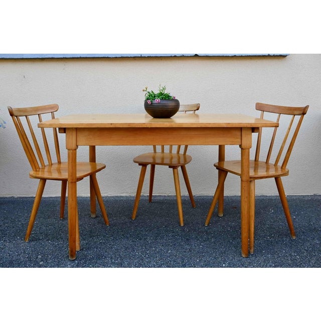 Here's a lovely set of solid wood bistro tables, perfect for a cozy café or pastry shop! Rectangular yet compact, these...