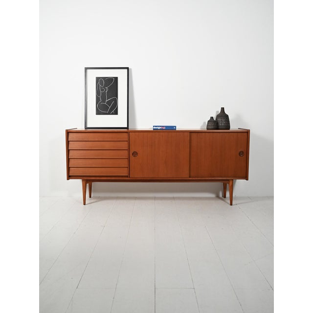 German teak sideboard from the 1960s, exhibited at the North German Furniture Show in Hamburg; original label preserved....